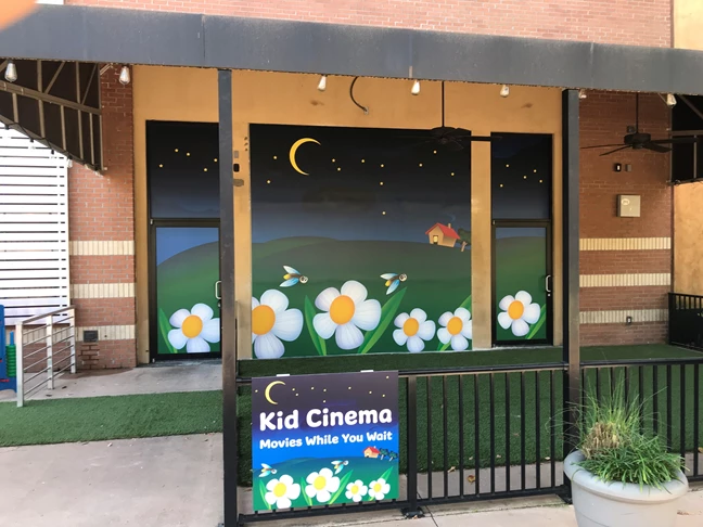Window Decals and Hanging Metal Sign for Movie Area at Local Mall